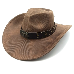 Detail of western cowboy hat with brown leather strap and bull head metal buckle