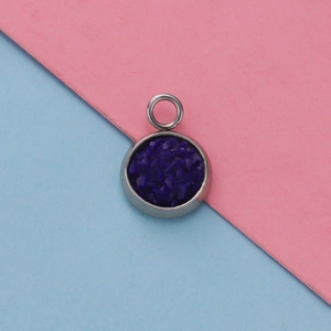 Macro shot of 12mm stainless steel pendant tray with deep blue starry texture detail