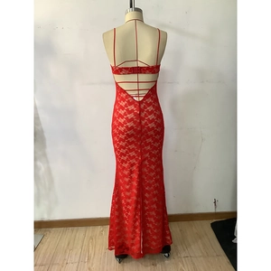 Detailed back view of red lace evening gown featuring spaghetti straps and backless design