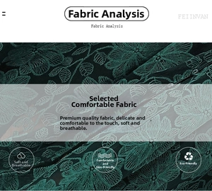 Detail aus dunkelgrünem Spitzenstoff mit floraler Stickerei und strukturierter Textur