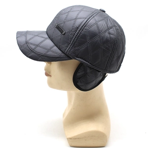 Detail view of winter baseball cap with diamond quilting and ear flaps for warmth