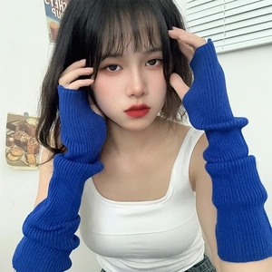 Detail of royal blue ribbed knit arm warmer with thumb hole for chic street style
