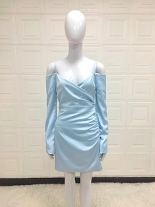 Detailed view of light blue satin dress with side ruching and elegant button accents