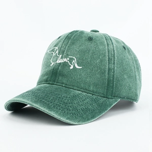 Detail of dachshund love embroidery on washed green cotton canvas baseball cap