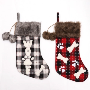 Classic plaid Christmas stockings with faux fur trim and cute pom-poms for holiday decor