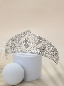 Detailed close-up of a silver vintage bridal crown with sparkling rhinestones and zircons