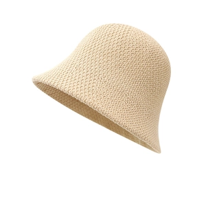 Chic beige knitted bucket hat with fine crochet texture for women in summer