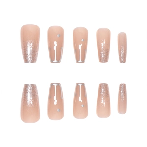 Sparkling long coffin press-on nails in nude pink with silver glitter gradient details