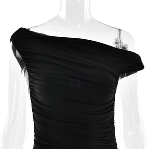 Detail of black one-shoulder dress showing intricate ruched fabric texture and fit
