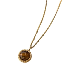 Vintage gold tiger eye stone pendant necklace with rope chain on white background