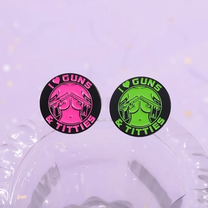 Creative round metal enamel badges featuring I Love Guns and Titties text and silhouette