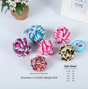 Close-up of multicolored cotton rope knot balls for dogs with various sizes and sizes chart