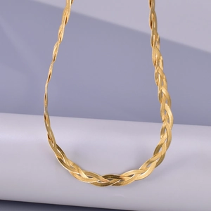 Macro view of triple-layered 18K gold-plated stainless steel braided snake chain necklace