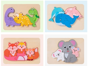 Detail of wooden 3D animal puzzles featuring dinosaur, ocean, fox, and koala themes