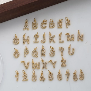 Gold plated stainless steel alphabet and number pendants with sparkling rhinestones set