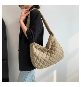 Quilted oversized hobo bag in khaki nylon showing soft texture and spacious half-moon shape