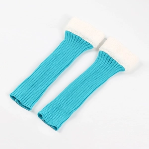 Detail of lake blue knitted leg warmers with white faux fur trim on a white background
