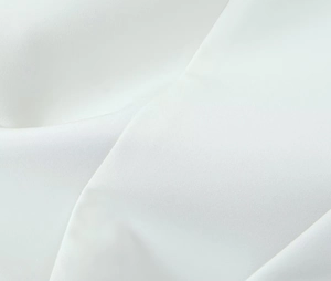 Close-up of white high-density fabric texture with soft satin gloss and elegant drape