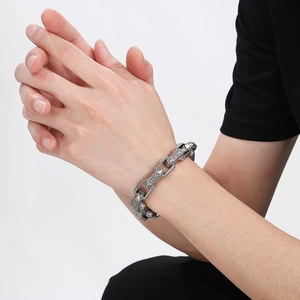 Vintage oxidized silver stainless steel chain bracelet with intricate ethnic patterns