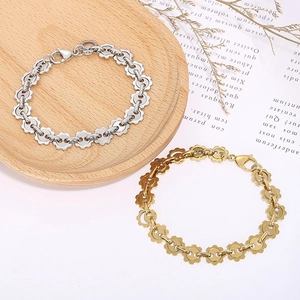 Industrial style gear link chain bracelet in silver and gold stainless steel finishes