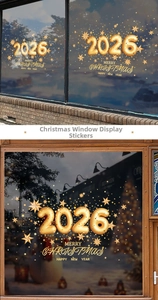 Detail of 2026 gold festive window stickers on a glass door with Christmas stars