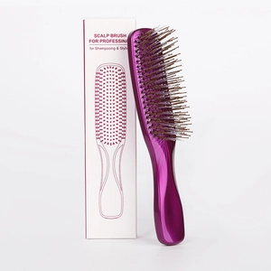 Purple scalp massage brush and professional packaging box shown on a white background