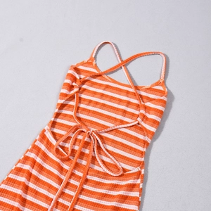 Close-up of orange striped knitted dress featuring cross strapless backless design detail