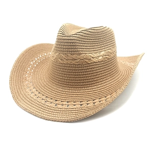 Detail of woven straw texture and hollow wave pattern on the brim of a western cowboy hat