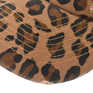 Detail of leopard print baseball cap featuring six rows of contrast yellow stitching