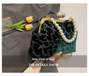 Detailed close-up of dark green velvet shell bag with pearl handle and metal clasp