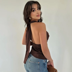 Detailed back view of dark brown satin halter top with adjustable lace-up straps