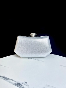 Elegant silver rhinestone evening clutch bag with a trapezoidal hard shell design