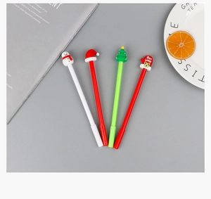 Detail of Christmas gel pens featuring Santa hat, snowman, and tree toppers in festive colors