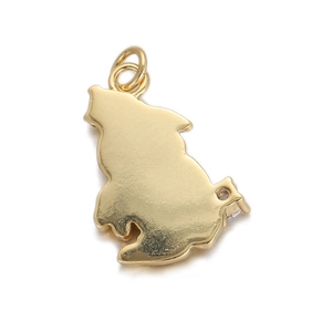 Macro shot of a minimalist gold animal silhouette charm with a polished glossy finish