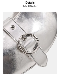 Close-up of metallic silver leather texture with eyelet strap and round metal buckle detail