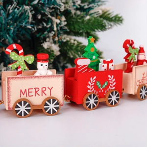 Detail of wooden Christmas train decor with Merry Christmas text and festive ornaments