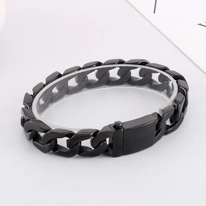 Detailed 45-degree angle of a men's thick black stainless steel Cuban link bracelet
