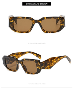 Close-up of leopard pattern rectangular sunglasses with dark brown lenses and wide frame
