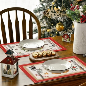 Linen Christmas placemat with Santa and tree patterns in festive dining setting