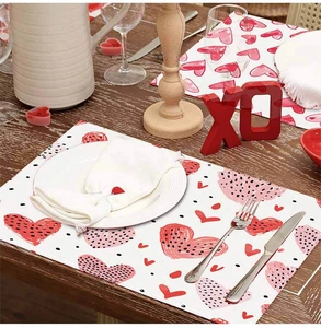 Linen Valentine heart table mat set on a wooden table with romantic dinner decor