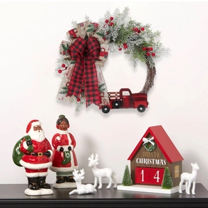 Christmas wreath with red truck and Santa figures for festive farmhouse door decoration