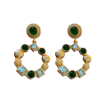 Vintage gold-plated drop earrings with green central stone and crystal accents