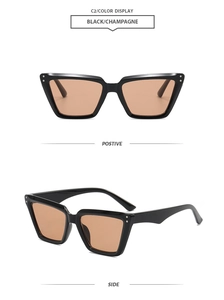 Front and side views of black cat-eye sunglasses with champagne lenses on white backdrop