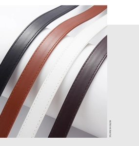 Close-up of four thin PU leather children belts with retro stitching in assorted colors