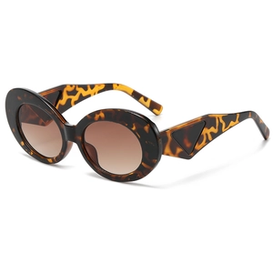 Retro tortoise oval sunglasses for women with brown lenses and side triangle detail