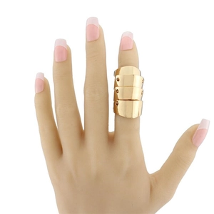 Detailed view of punk style gold multi-layered joint ring on finger with flexible link structure