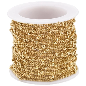 Roll of 18k gold plated stainless steel satellite curb chain with metal beads on white spool