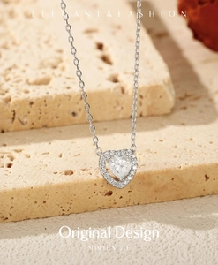 Close-up of heart-shaped sterling silver necklace with 0.5ct moissanite on stone