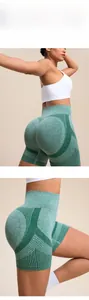 Close-up of green seamless high-waist yoga shorts with scrunch butt and breathable texture