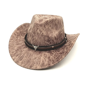 Brown western cowboy hat with cracked leather texture and bull skull metal ornament